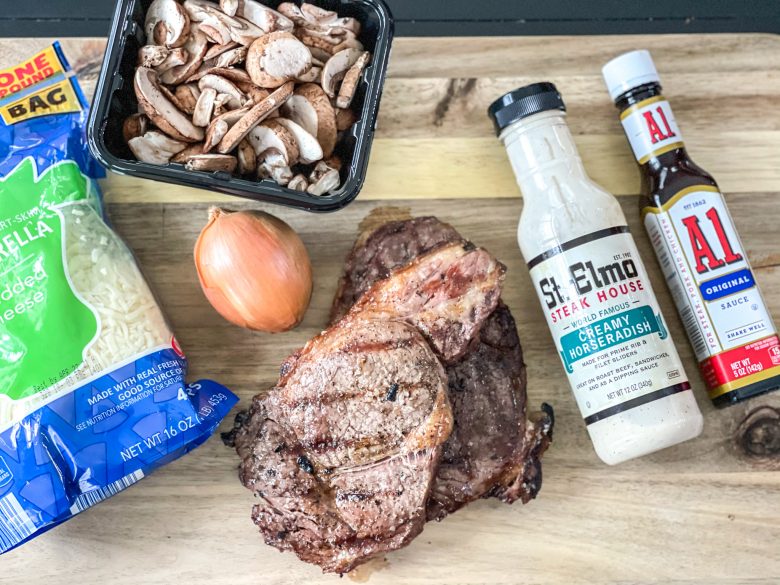 Ribeye steak, mozzarella cheese, onion, sliced mushrooms, horseradish sauce, and A1 sauce. 