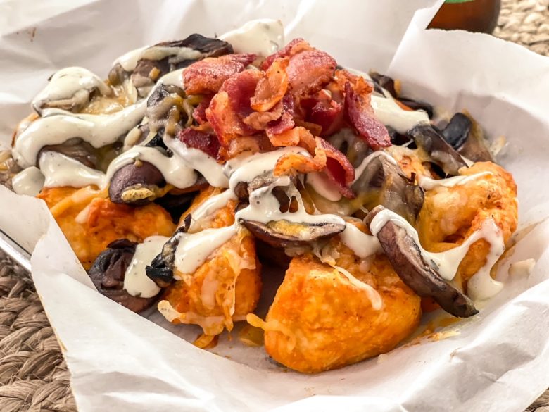 Boneless chicken chunks with melted cheese, mushrooms and bacon drizzled with Ranch