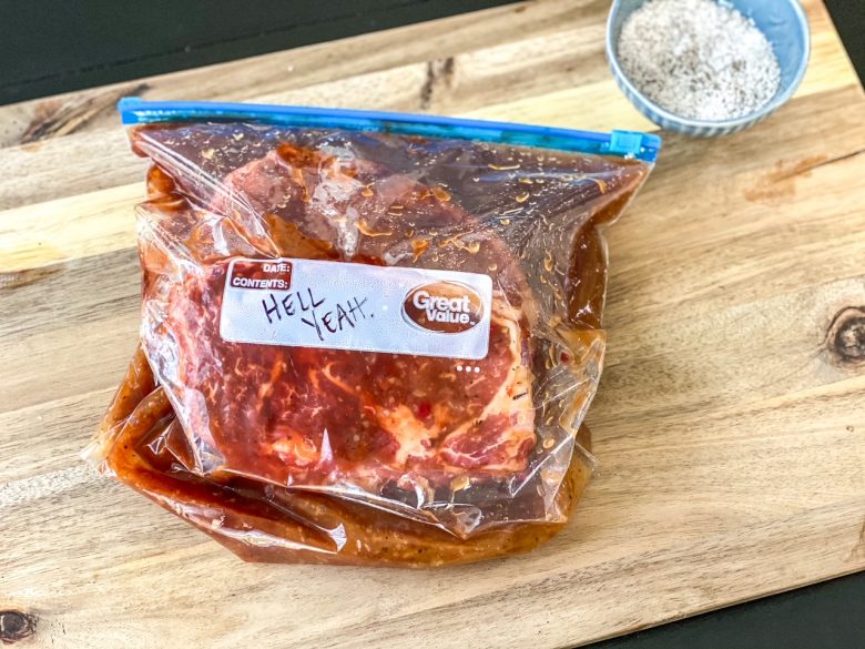 Ribeyes marinating in a gallon ziplock bag. 