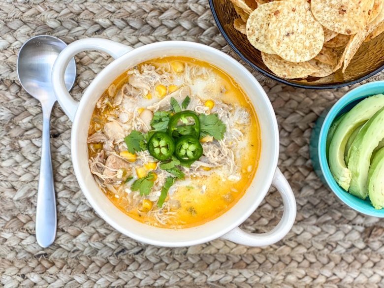 White chicken chili with jalapeno, avocado and tortilla chips. 