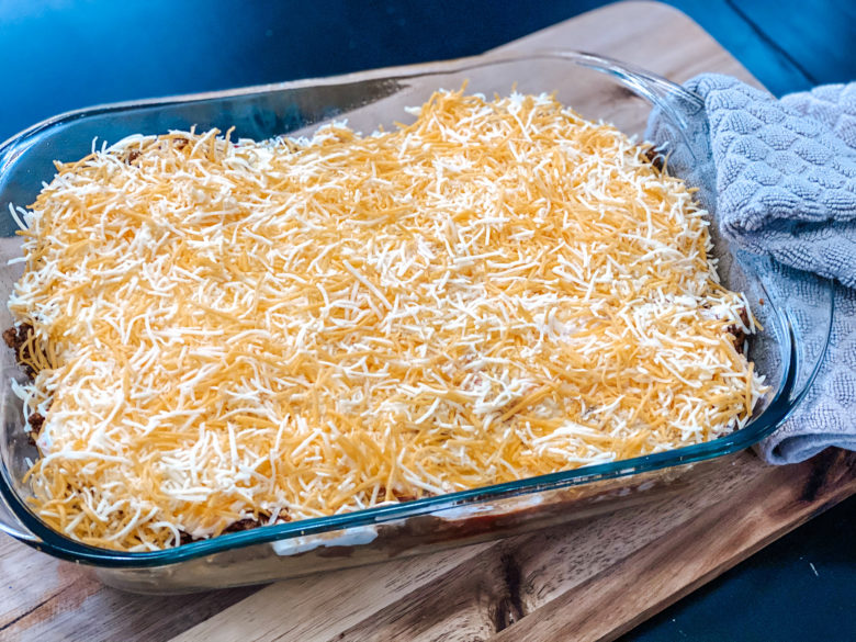 Taco casserole with shredded cheese. 
