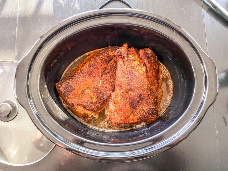 Pork shoulder in a crock pot with BBQ rub and beer. 