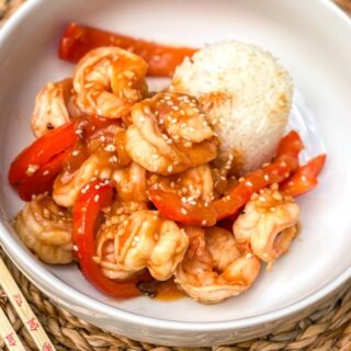 Szechuan Shrimp with white rice in a bowl.